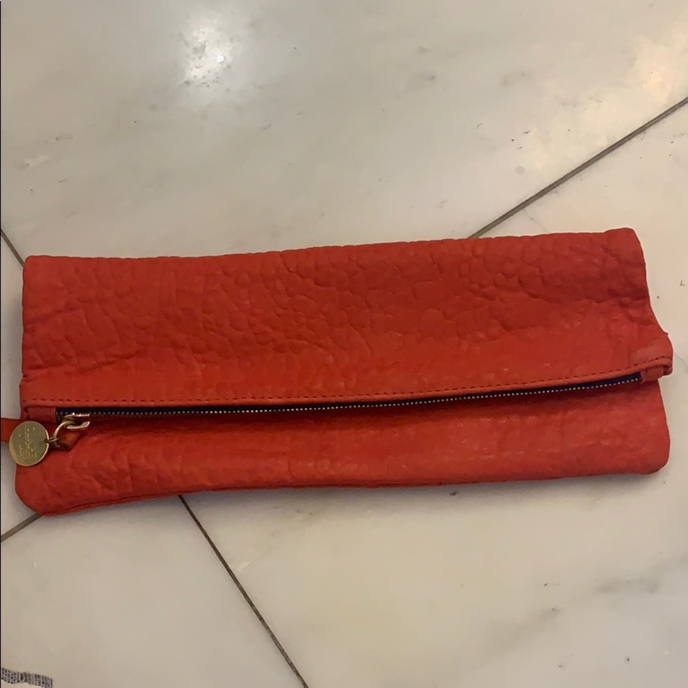 Clare Vivier red folder over clutch